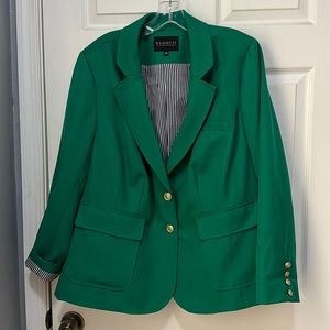 Green blazer with striped lining and gold buttons.